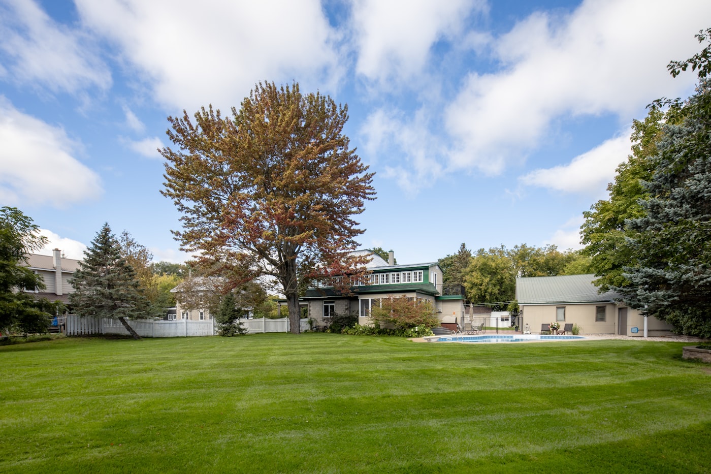 Manicured lawn and landscaped property