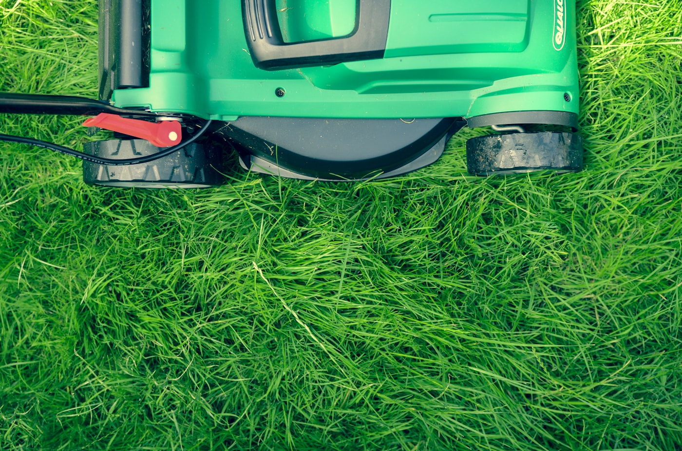 Mowing a green lawn